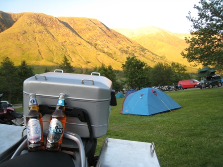 A couple of friends relax on my bike at Glen Nevis campsite
