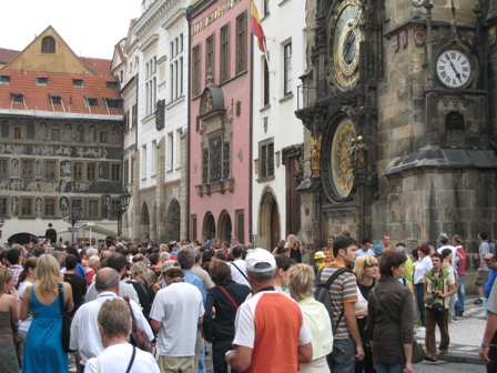 Crowds gather to watch the Astronomical Clock do its thing…