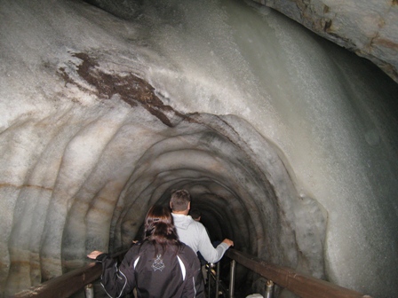 Tracy enters the ice cave through a tunnel carved in the ice…