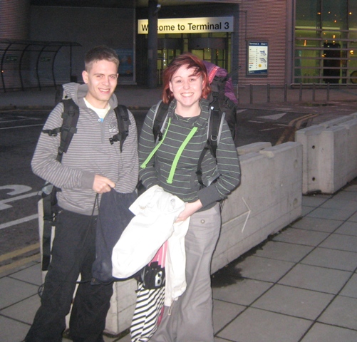 Laura and Chris outside Manchester Airport at the start of their Round-the-World adventure