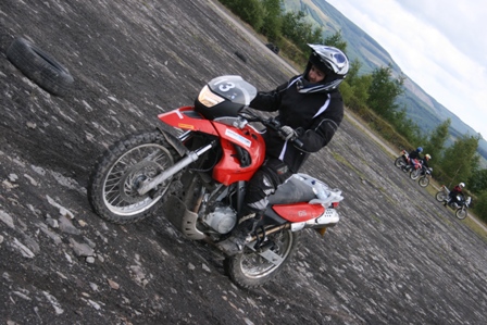 Tracy sliding the rear on her BMW F650GS…