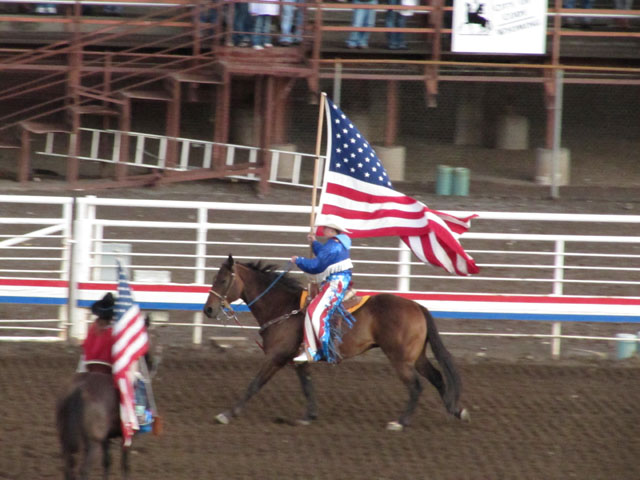 Parading the Stars 'n' Stripes at the start of the rodeo...