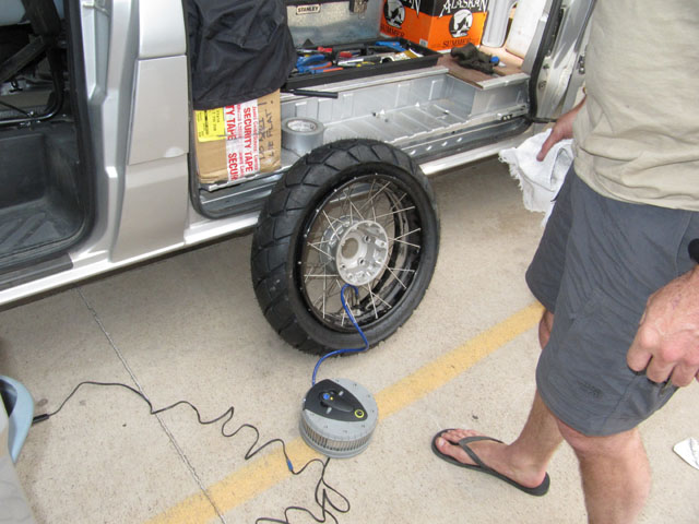 Step 8: Inflate the tyre using a compressor, hoping that it will force the bead onto the rim...