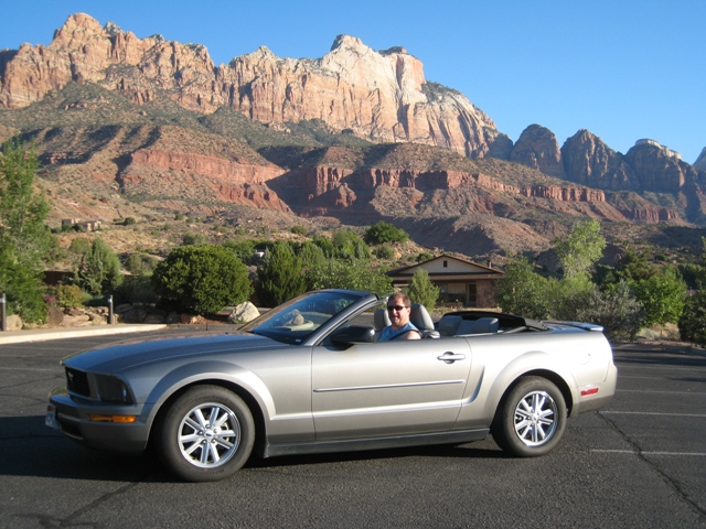 Paul posing in the Mustang outside Majestic View Lodge